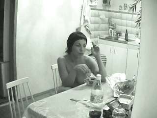 Naked wife walks through the kitchen with a cigarette on a hidden camera