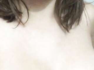 Busty takes pictures on the phone as she caresses pussy with her finger