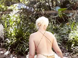 Blonde beauty in leopard bikini