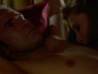 Passionate Mimi Rogers ties up her lover in bed and fucks him