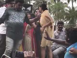 Indian woman dancing with naked boobs in front of the crowd at some kind of holiday